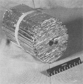 Metallic material tightly folded into a cylindrical shape