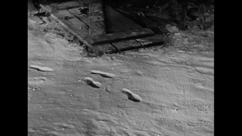 The Invisible Man movie from 1933 showing footprints being created in snow